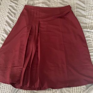 Maroon Eloquii skirt with ruffle and high slit detailing